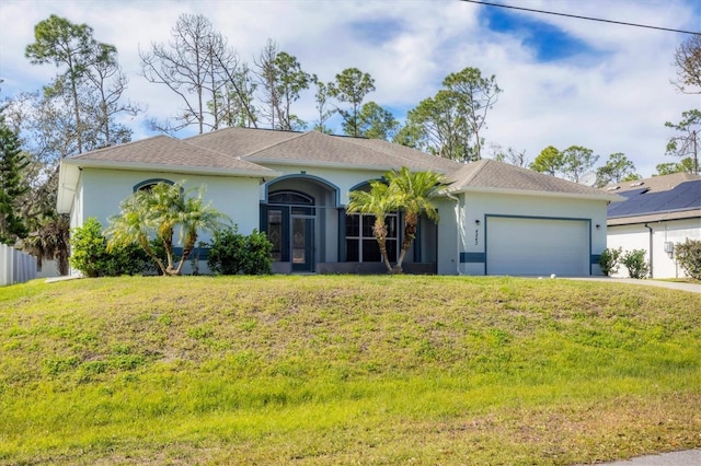 ranch-style home with solar panels, a front lawn, and a garage