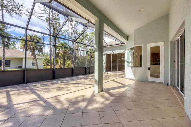 unfurnished sunroom with vaulted ceiling