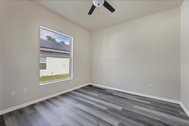 unfurnished room featuring dark hardwood / wood-style floors and ceiling fan