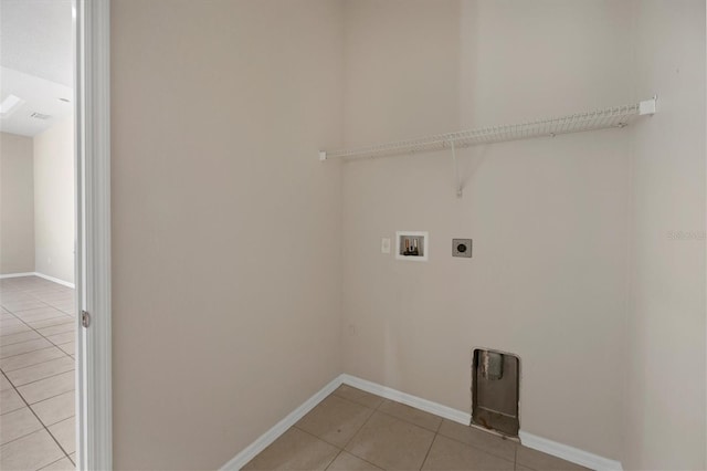 washroom featuring electric dryer hookup, hookup for a washing machine, and light tile floors