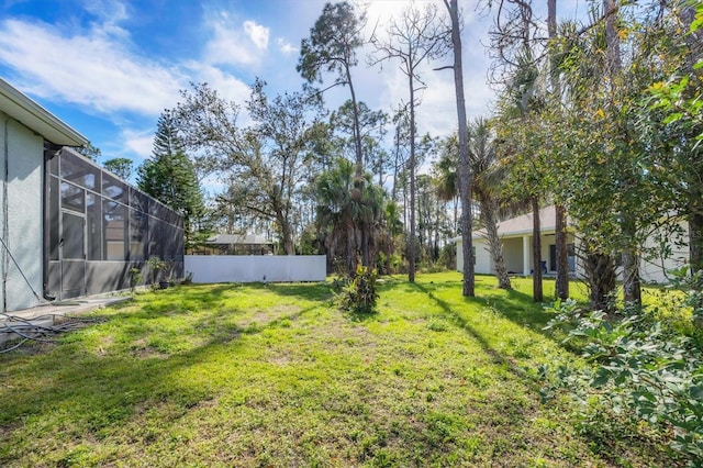 view of yard featuring a lanai