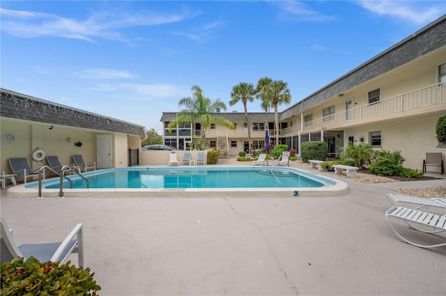 view of pool featuring a patio