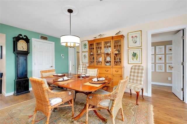 dining area with light wood-type flooring