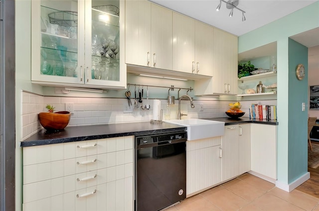 kitchen with tasteful backsplash, sink, light tile floors, and dishwasher