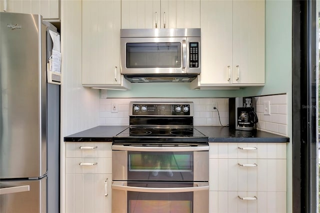 kitchen featuring white cabinets, backsplash, and stainless steel appliances