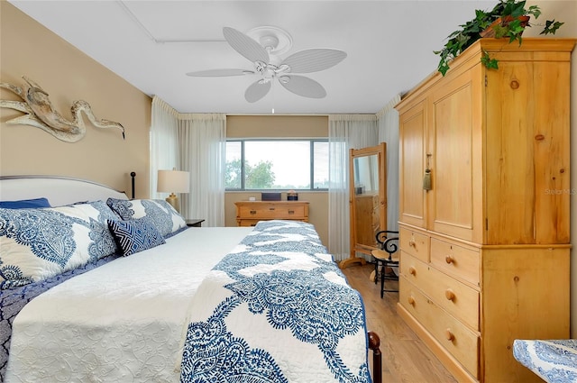 bedroom featuring ceiling fan and light wood-type flooring