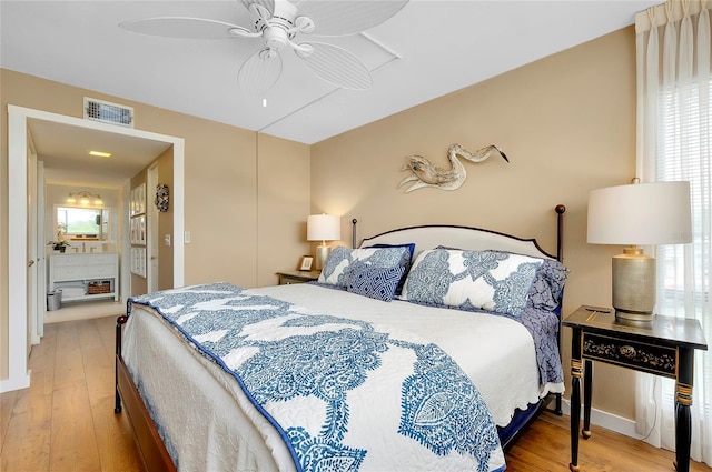 bedroom with multiple windows, ceiling fan, and light hardwood / wood-style flooring