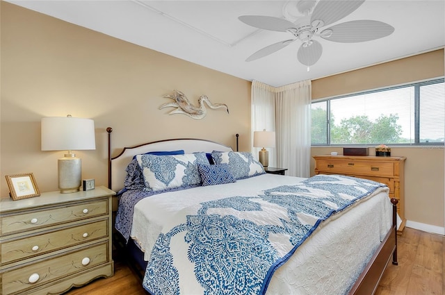 bedroom featuring light hardwood / wood-style floors and ceiling fan