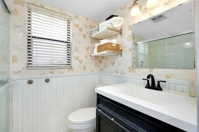 bathroom featuring toilet and vanity