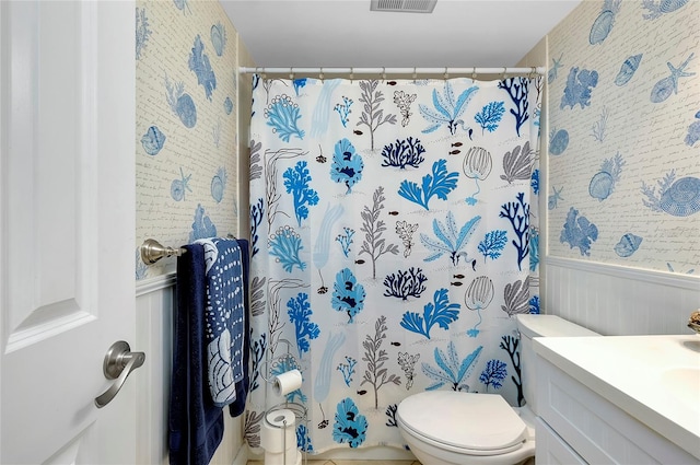 bathroom with toilet and vanity