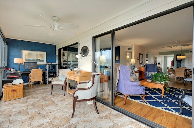 sunroom with ceiling fan