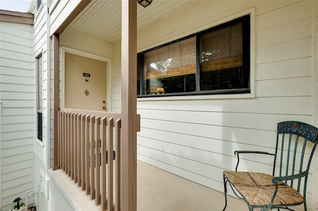 view of exterior entry featuring a porch