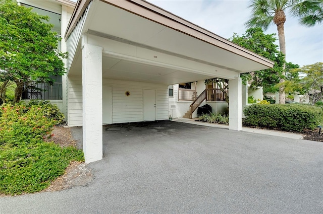 view of parking / parking lot featuring a carport