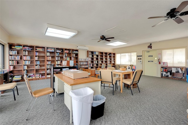 carpeted office with a wall mounted air conditioner and ceiling fan