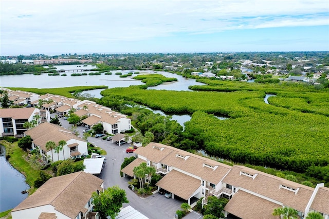 birds eye view of property with a water view