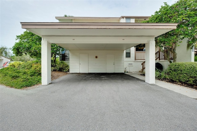 garage featuring a carport