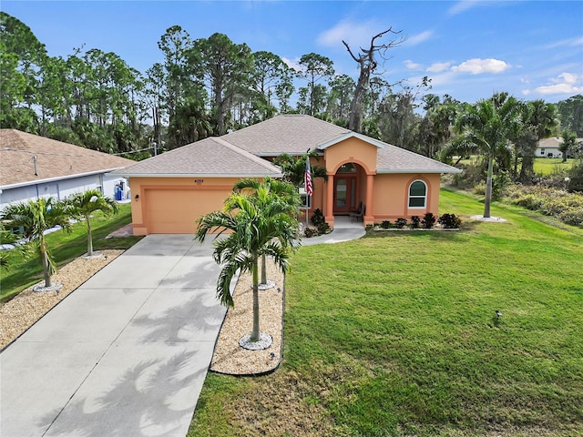 view of front of house featuring a front yard and a garage