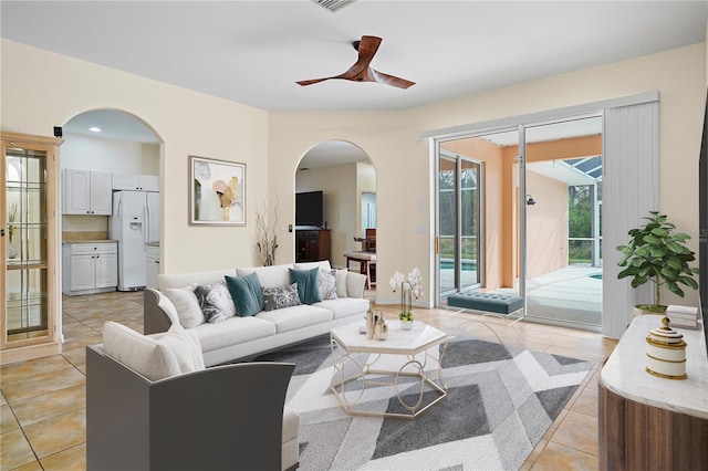 living room with ceiling fan and light tile floors