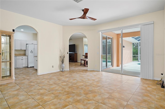 tiled empty room with ceiling fan