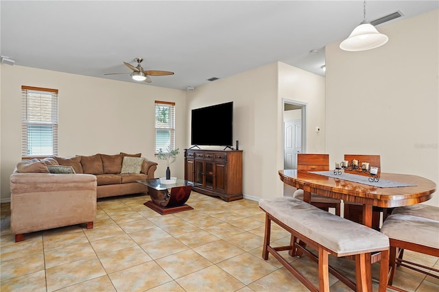 tiled living room featuring ceiling fan