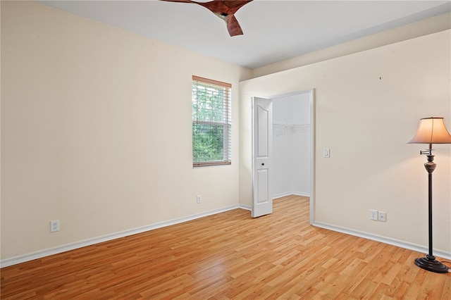 spare room featuring ceiling fan and light wood-type flooring