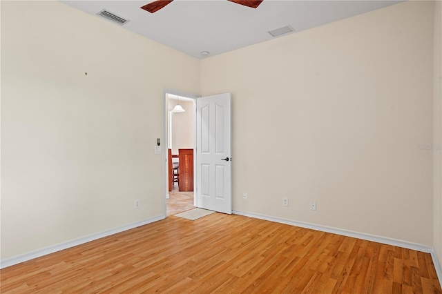 unfurnished room with ceiling fan and light wood-type flooring