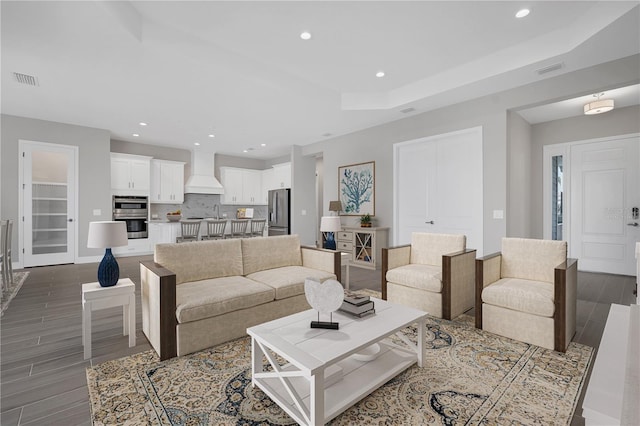 living room featuring dark hardwood / wood-style flooring