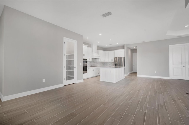 unfurnished living room featuring light hardwood / wood-style flooring