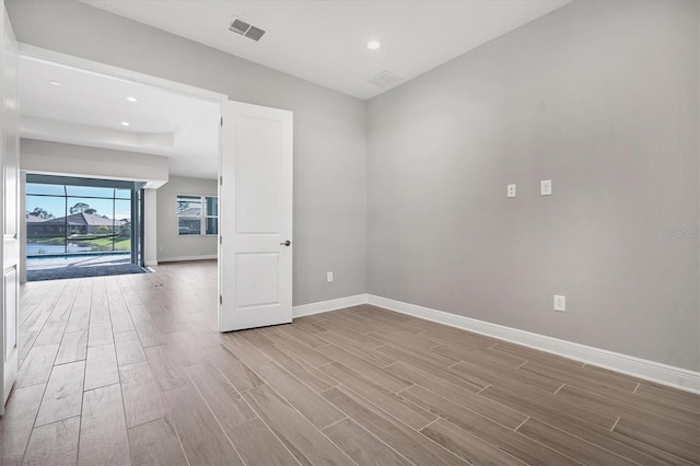 spare room with light wood-type flooring