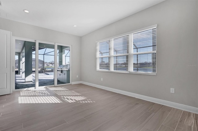 empty room featuring hardwood / wood-style flooring