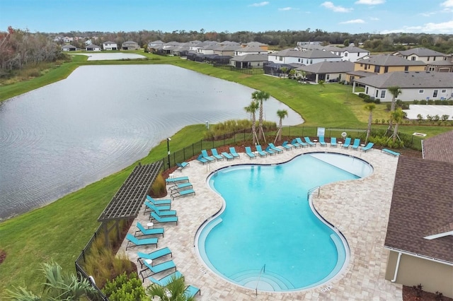 view of swimming pool with a water view