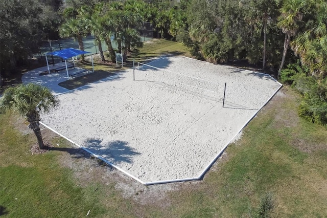 view of home's community featuring volleyball court