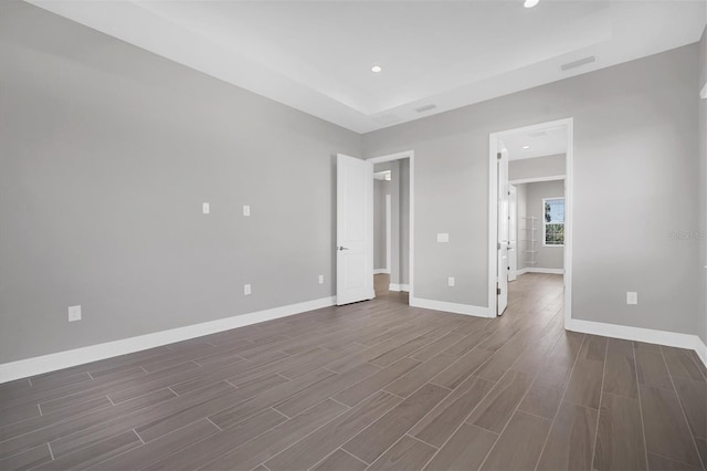 empty room with dark hardwood / wood-style floors