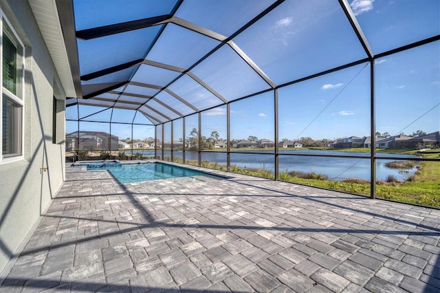 view of pool with a water view, a patio area, and a lanai