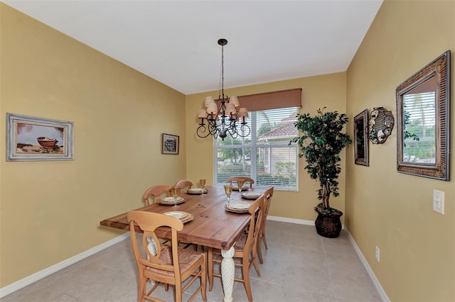 dining space with a chandelier, plenty of natural light, and light tile floors