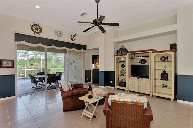 living room with ceiling fan and light tile floors