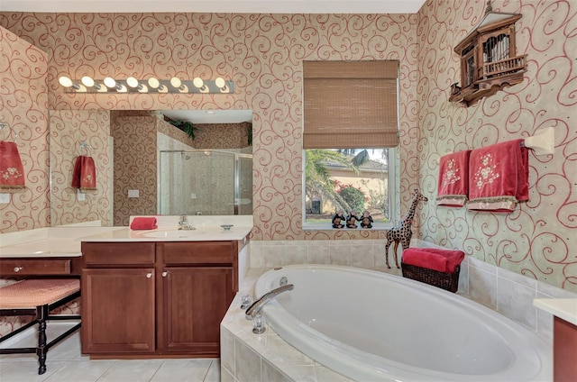 bathroom featuring separate shower and tub, large vanity, and tile floors