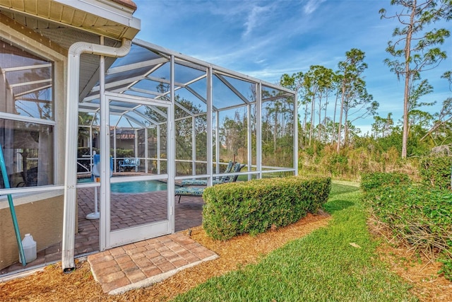 view of yard featuring a patio area and a lanai