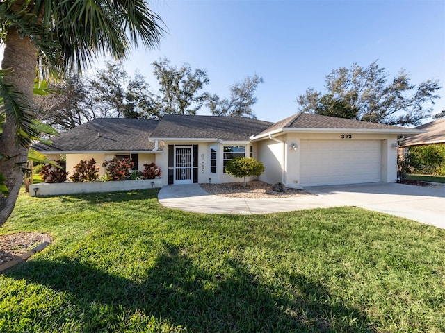 single story home featuring a front lawn and a garage