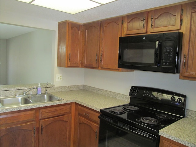 kitchen featuring black appliances and sink