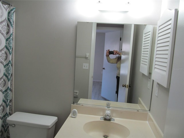 bathroom with oversized vanity and toilet