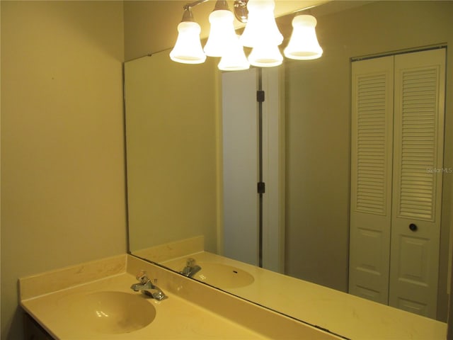 bathroom featuring vanity and an inviting chandelier