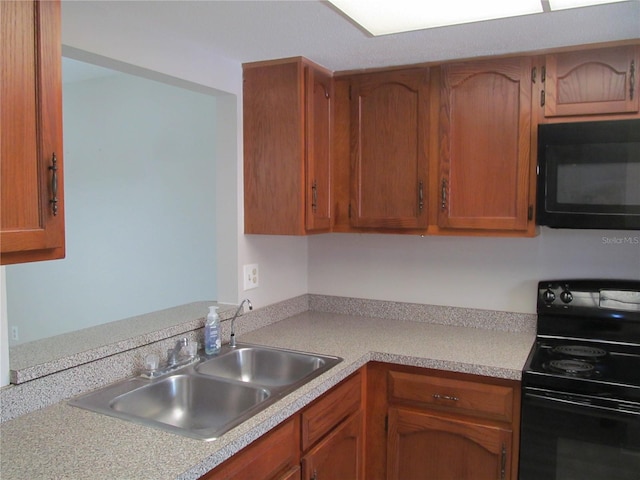 kitchen with sink and black appliances