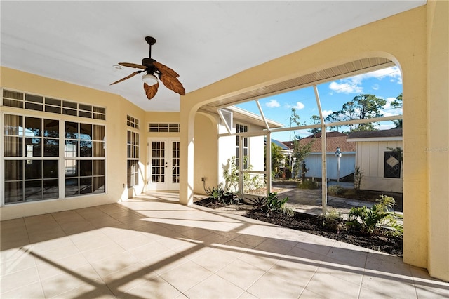 view of terrace with a storage unit, ceiling fan, and french doors