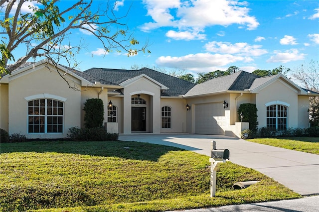 ranch-style house with a front yard and a garage