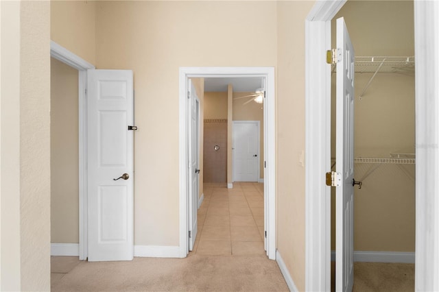 corridor featuring light carpet