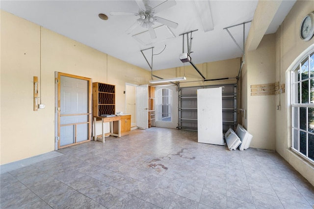 garage featuring a garage door opener and ceiling fan