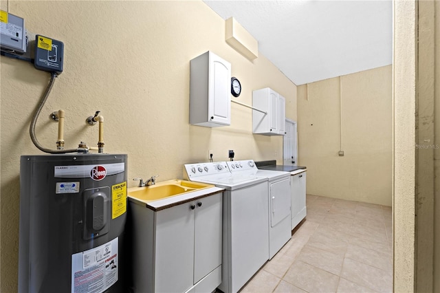 laundry room featuring cabinets, sink, light tile floors, water heater, and washer and dryer