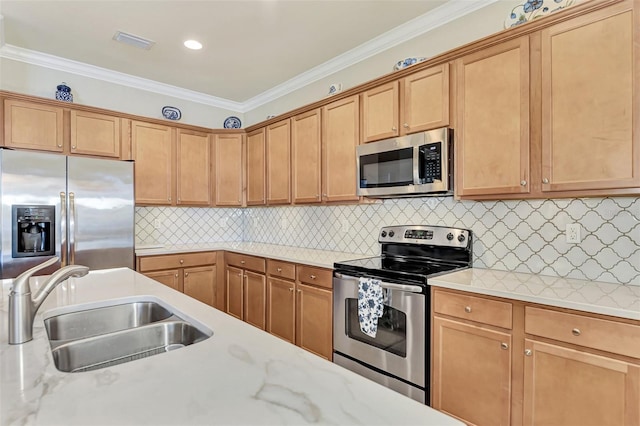 kitchen featuring backsplash, ornamental molding, appliances with stainless steel finishes, and sink