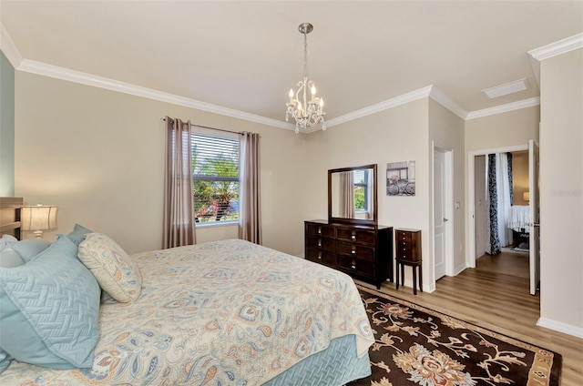 bedroom featuring crown molding, a chandelier, and light hardwood / wood-style flooring